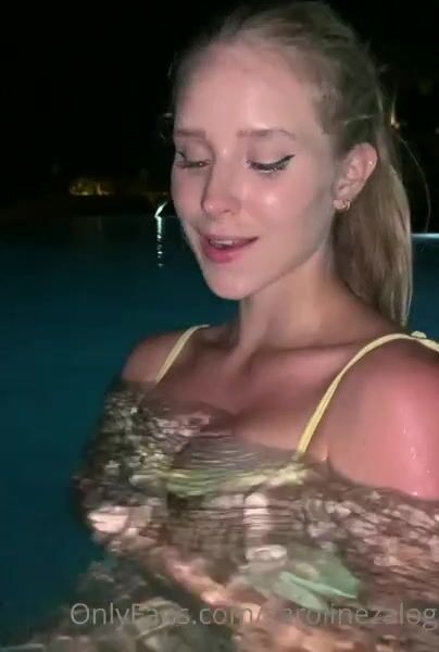 Caroline Zalog in swimming pool at night