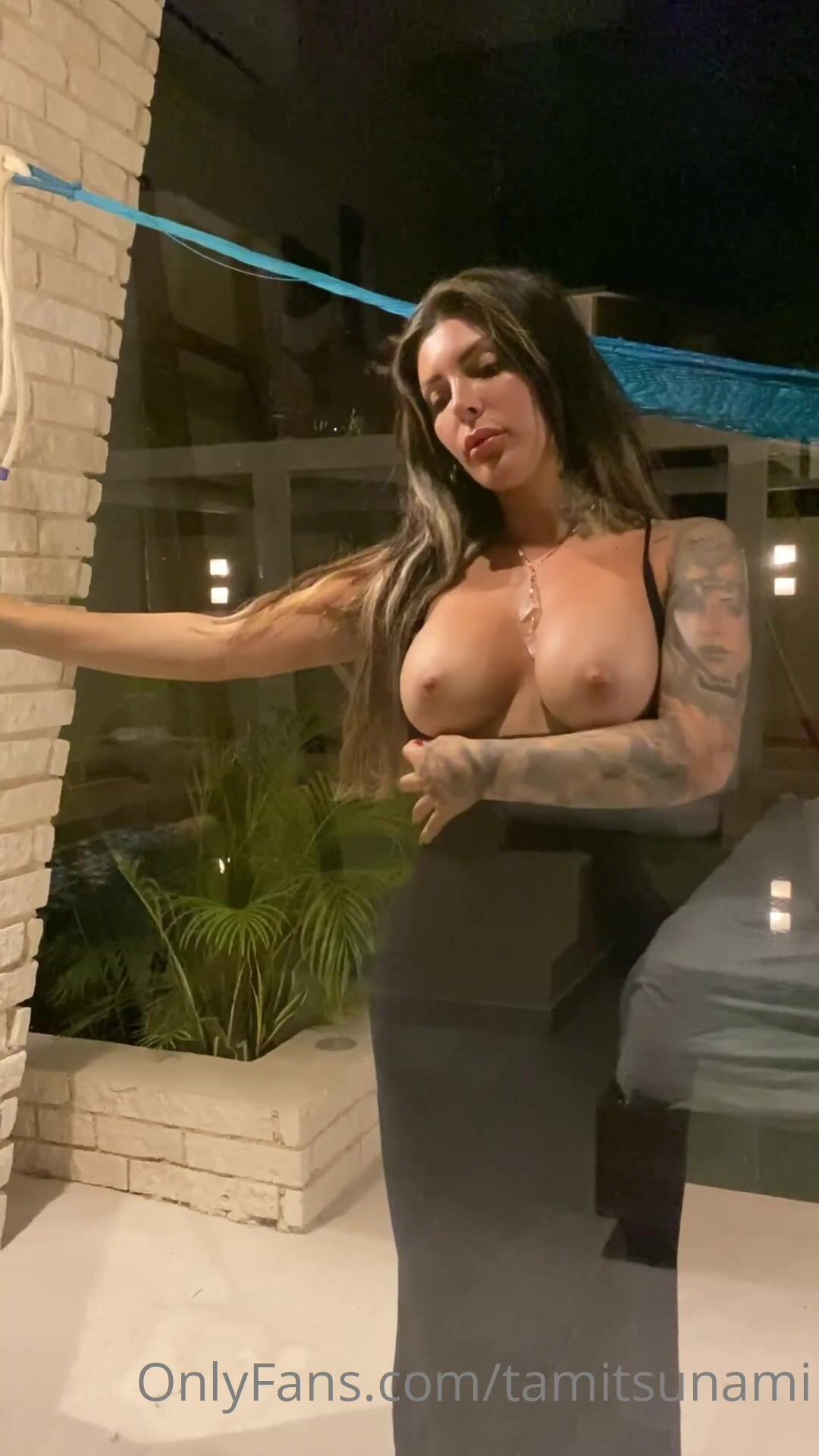 Tami Minou undressing in front of glass