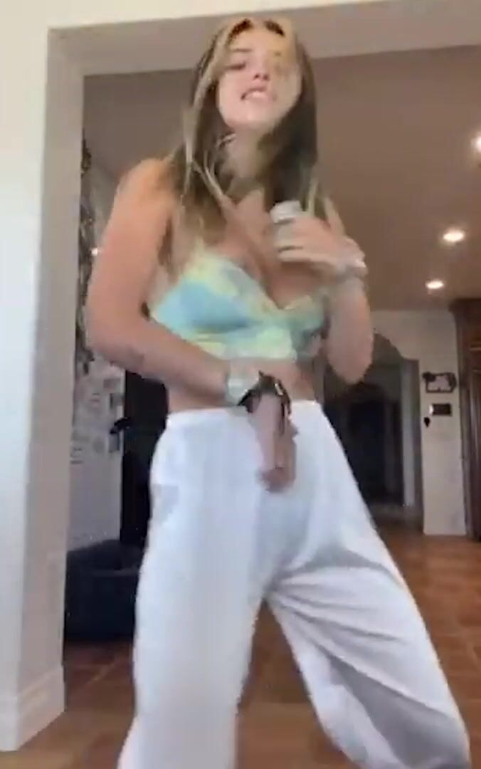 Bella Thorne her right areola peeks out of her top on IG live
