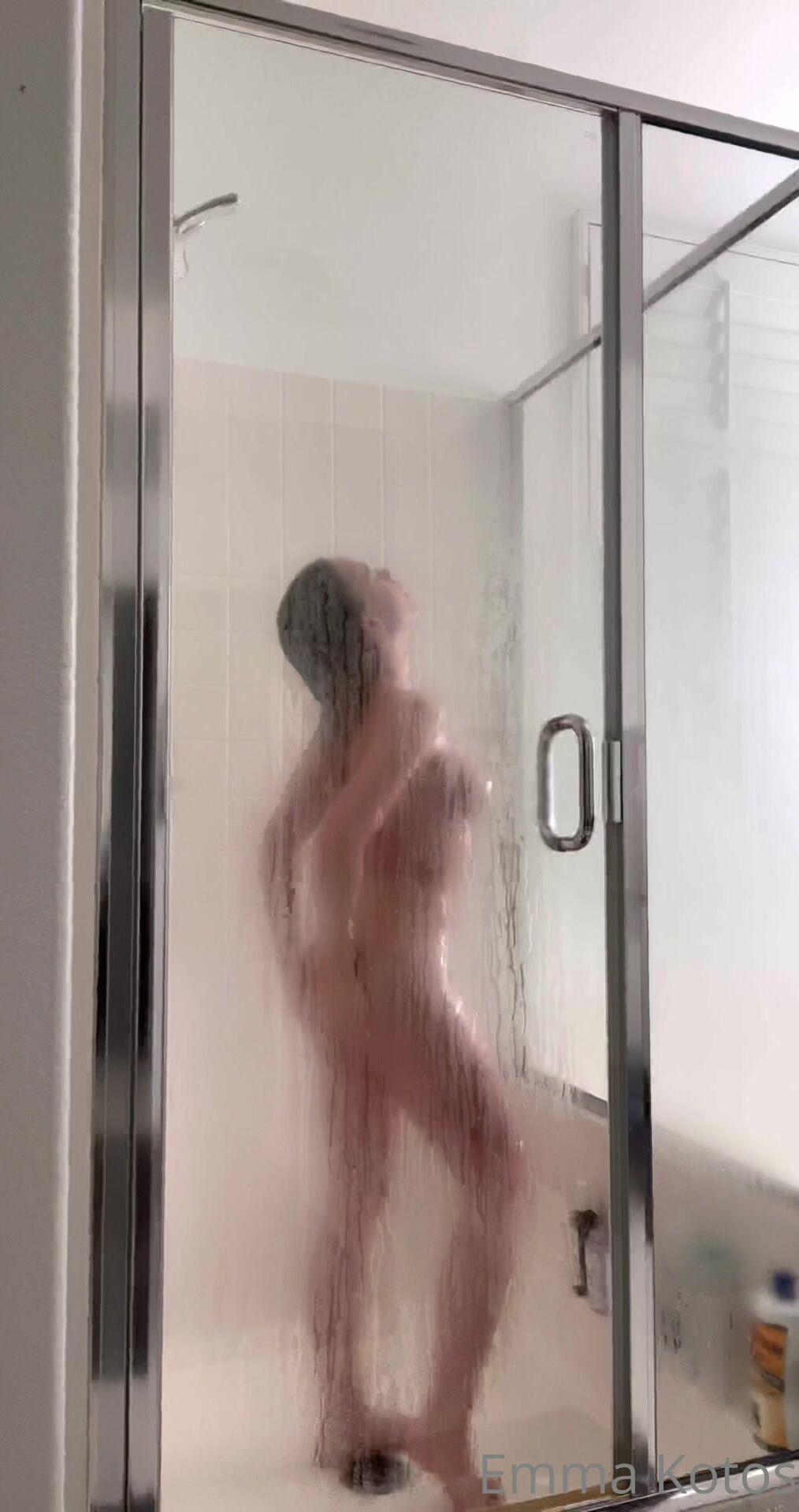 Emma kotos - a glimpse of her pussy in shower